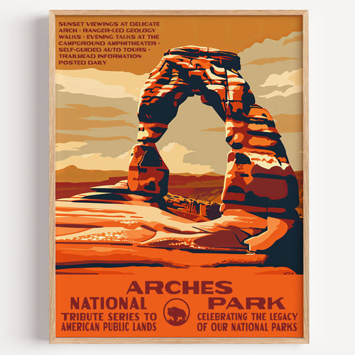 Arches National Park wall art print in a thin wood frame, Delicate Arch standing alone against a burnt-orange sky
