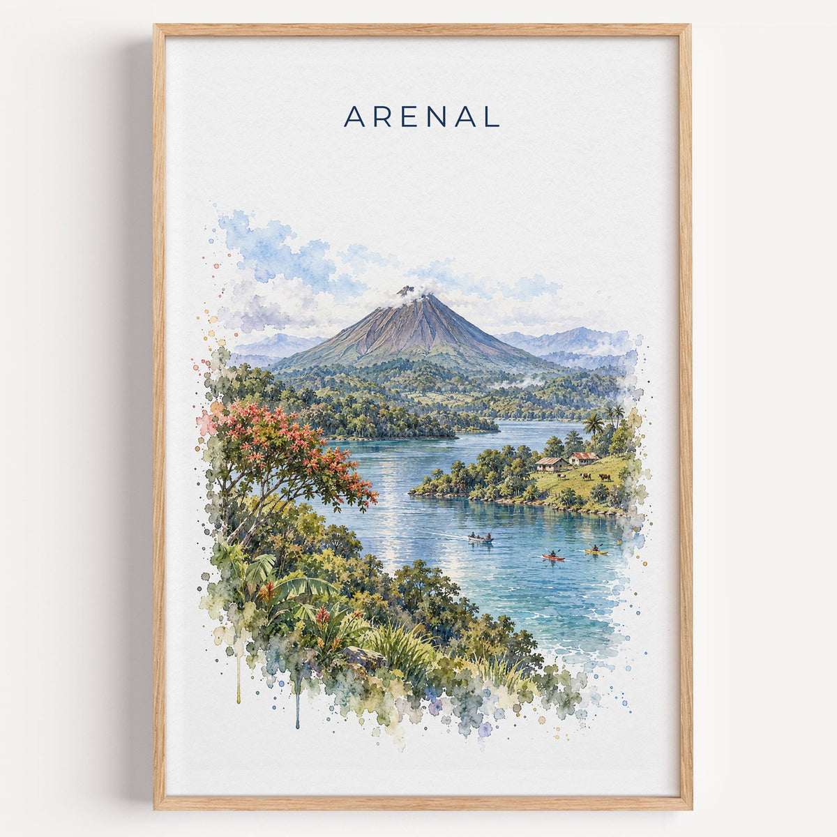Arenal Volcano watercolor print in a light oak frame on a plain white wall