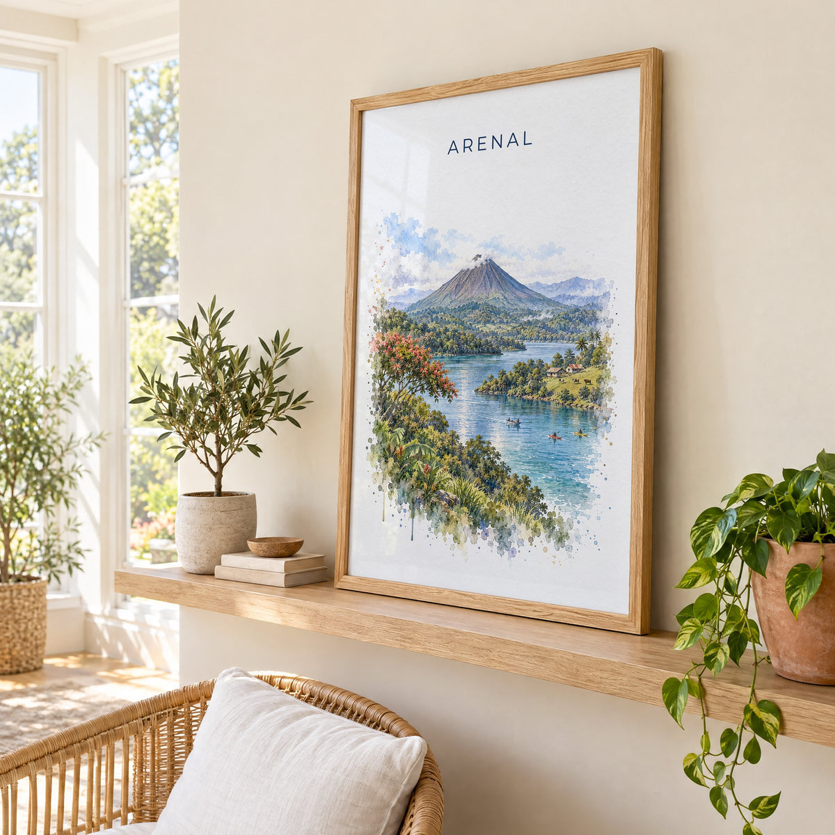 Arenal Volcano watercolor print in an oak frame on a picture ledge in a sunlit sunroom