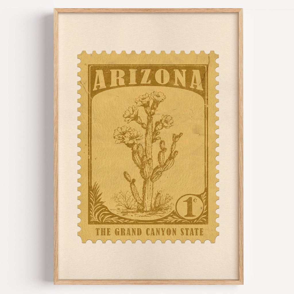 Arizona state flower stamp print in bronze gold on wheat, light oak frame on a plain white wall