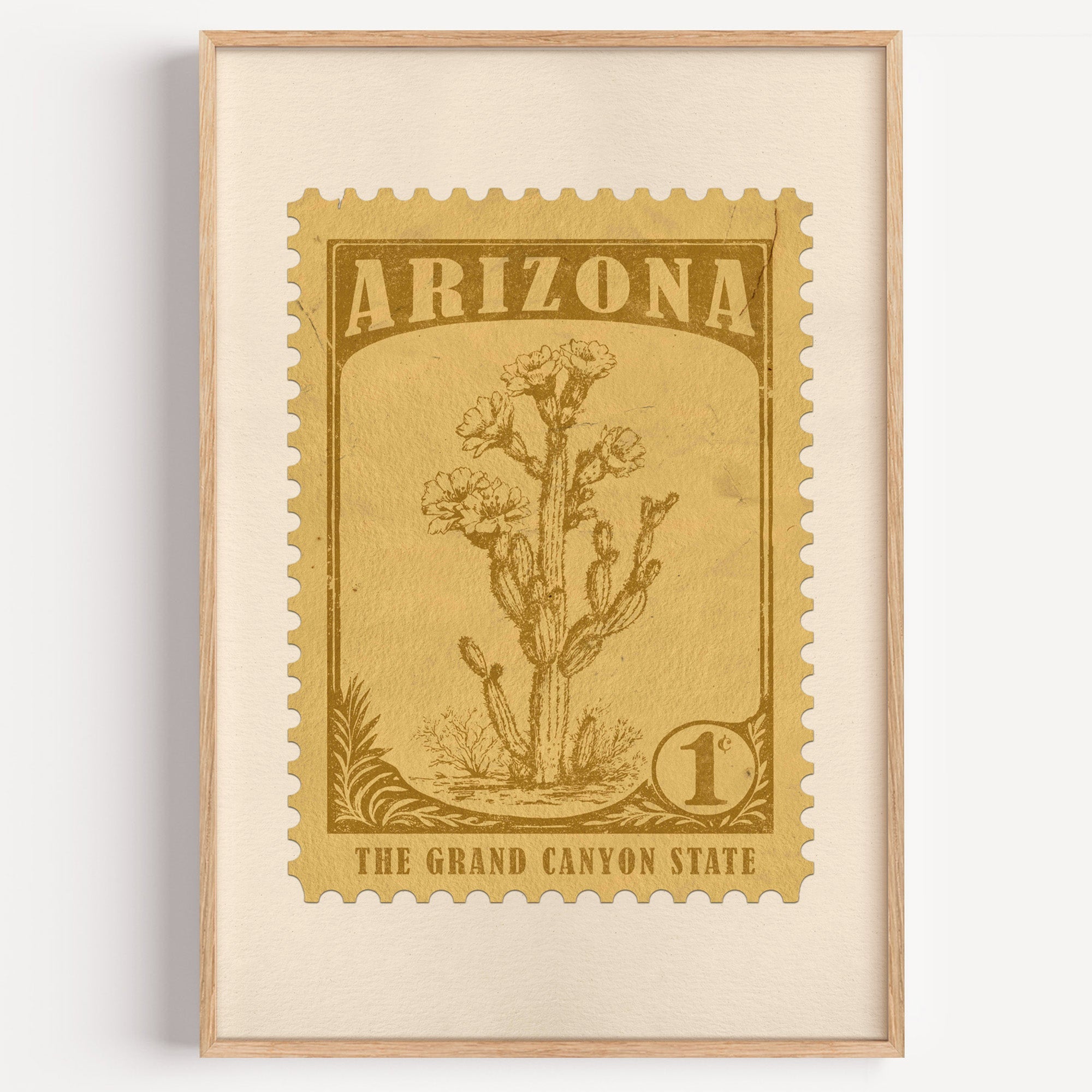 Arizona state flower stamp print in bronze gold on wheat, light oak frame on a plain white wall