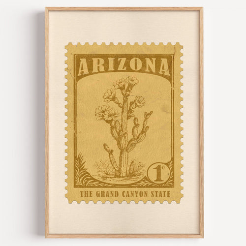 Arizona state flower stamp print in bronze gold on wheat, light oak frame on a plain white wall