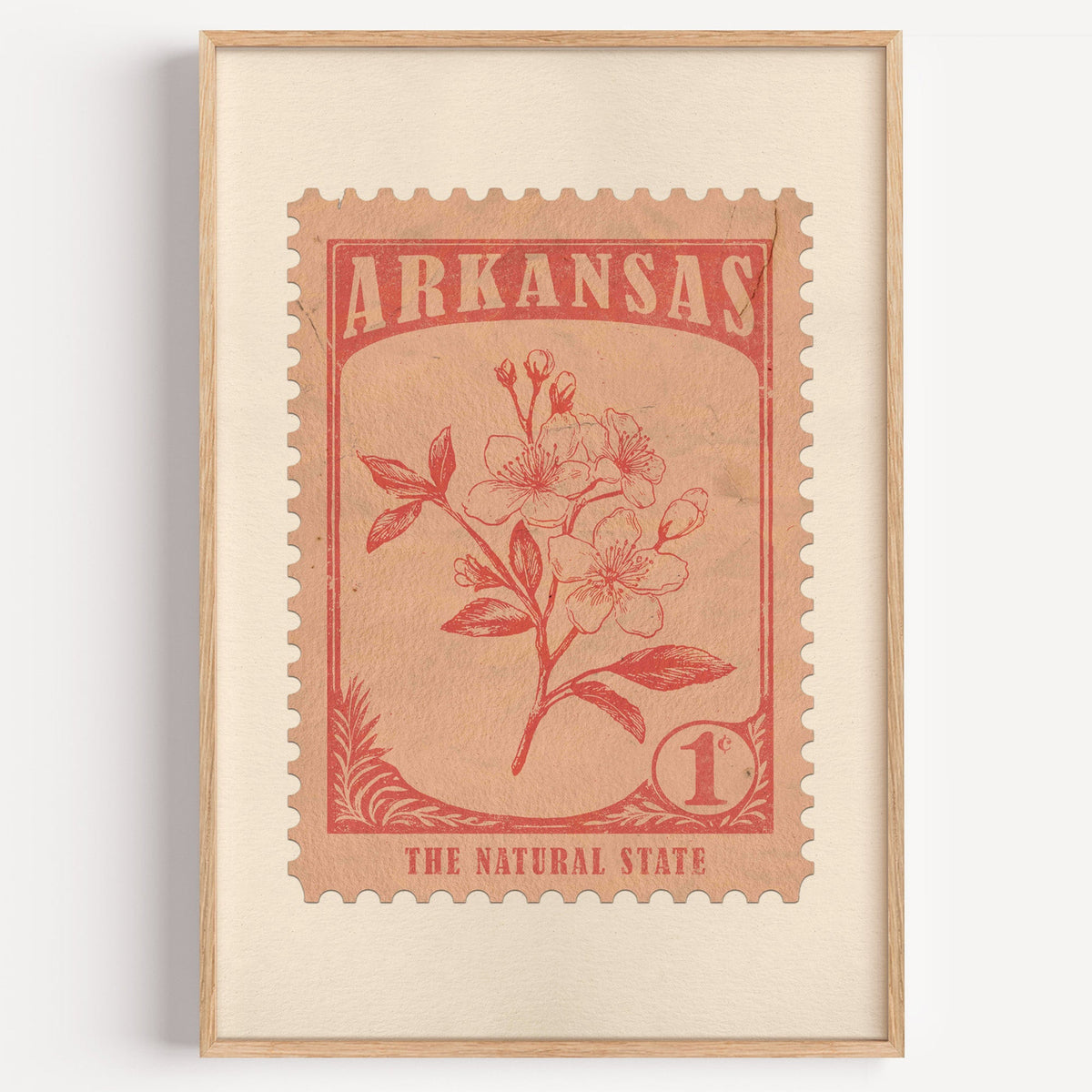 Arkansas state flower stamp print in terracotta on blush, light oak frame on a plain white wall