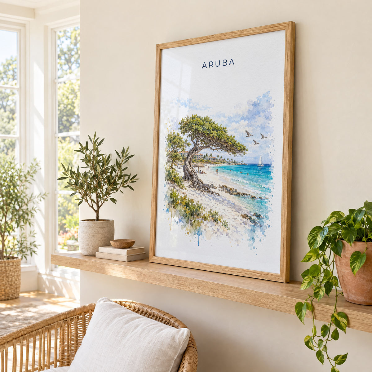 Aruba watercolor print in an oak frame on a picture ledge in a sunlit sunroom