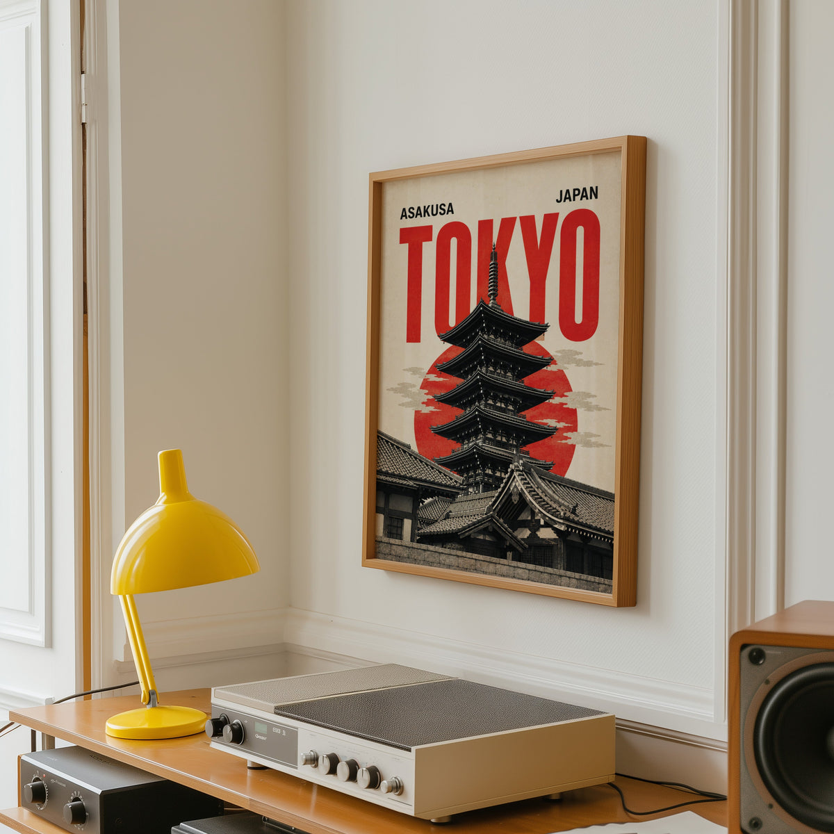 Asakusa Tokyo pagoda poster in an oak frame above a vintage hi-fi shelf with a yellow desk lamp