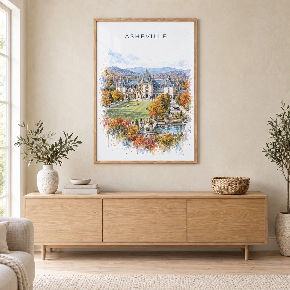Asheville watercolor print in an oak frame above a light wood sideboard in a Scandinavian living room