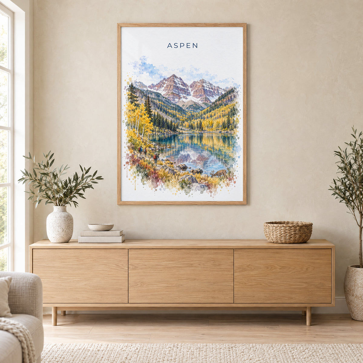 Aspen watercolor print in an oak frame above a light wood sideboard in a Scandinavian living room