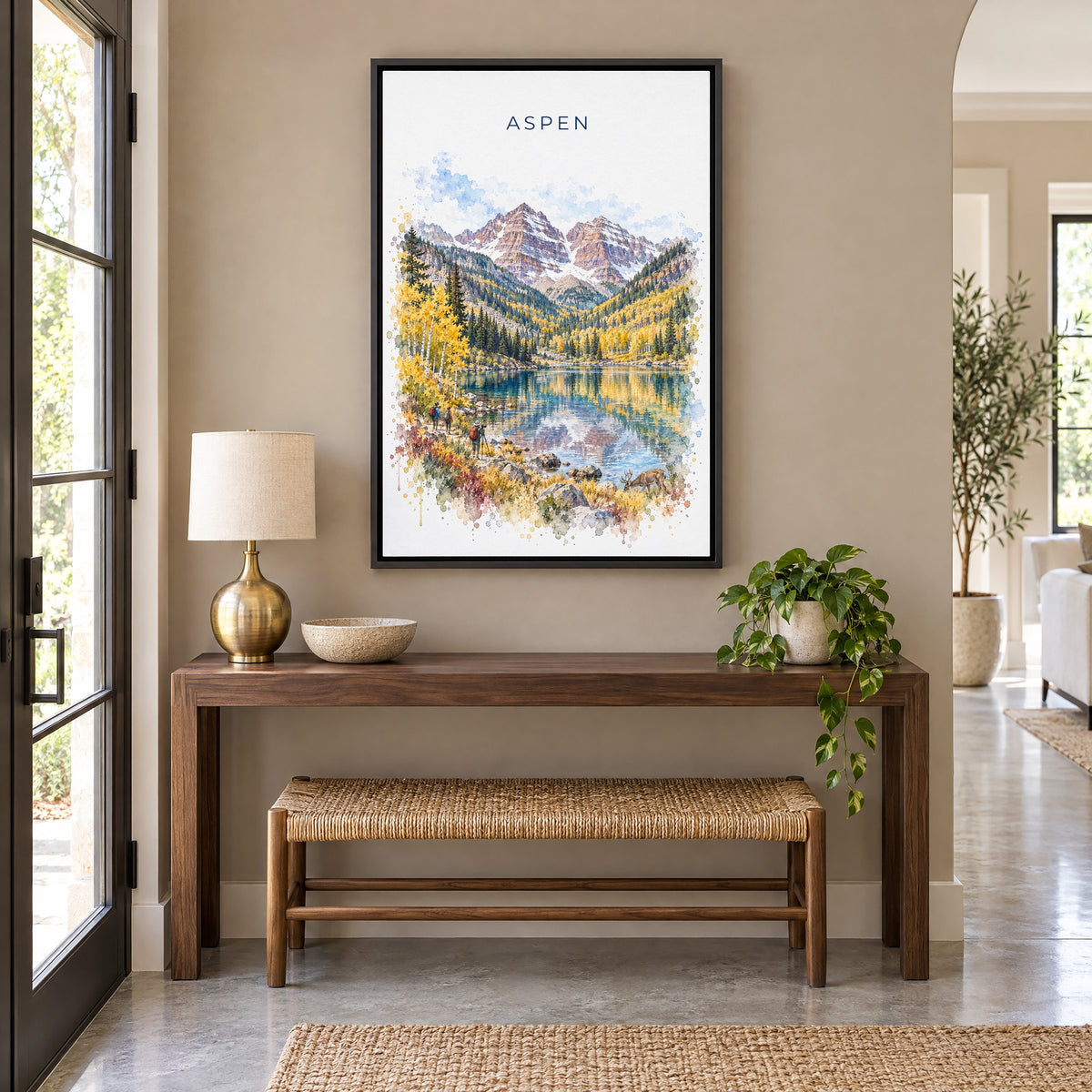 Aspen watercolor print as a black floater canvas above a walnut console and woven bench in an entryway