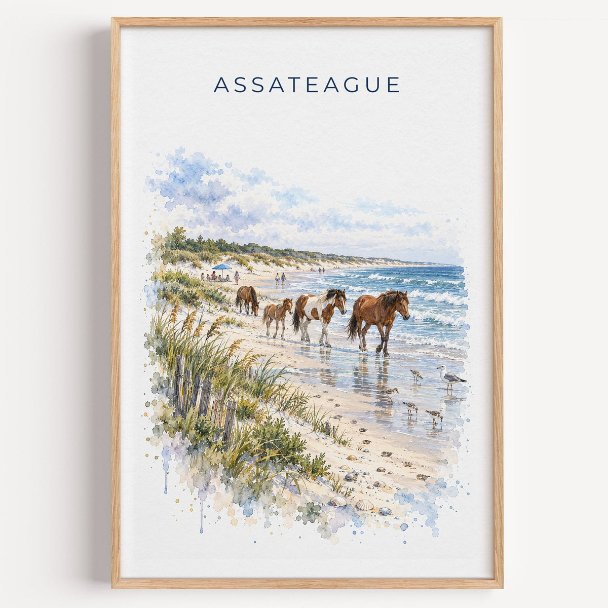Assateague Island National Seashore watercolor print in a light oak frame on a plain white wall