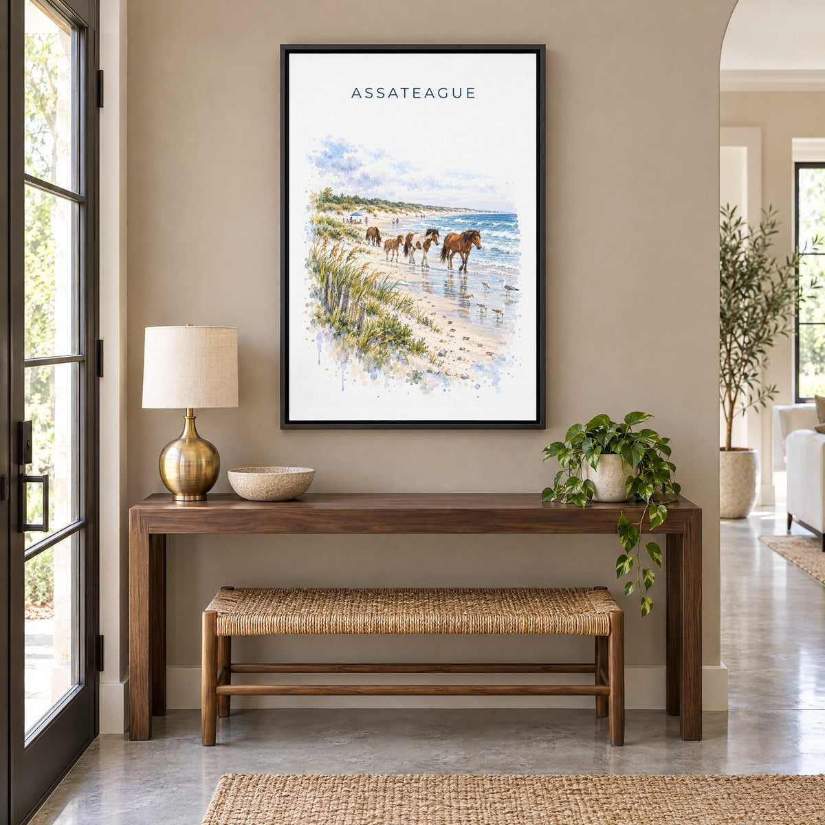 Assateague Island National Seashore watercolor as a black floater canvas above a walnut console and woven bench in an