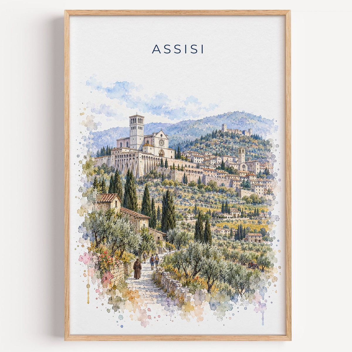 Assisi watercolor print in a light oak frame on a plain white wall