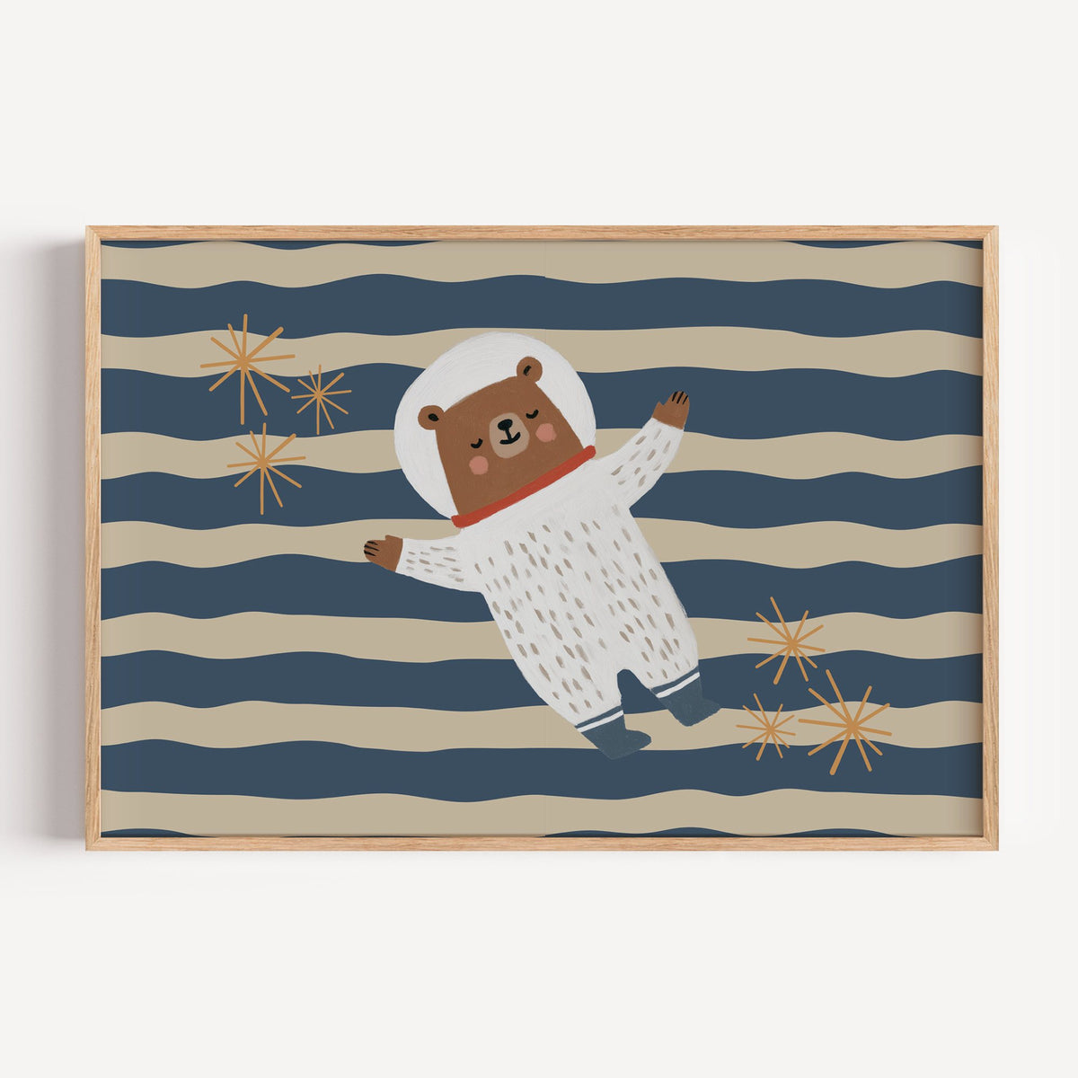 Landscape astronaut bear wavy stripe nursery print in a light oak frame on a plain white wall