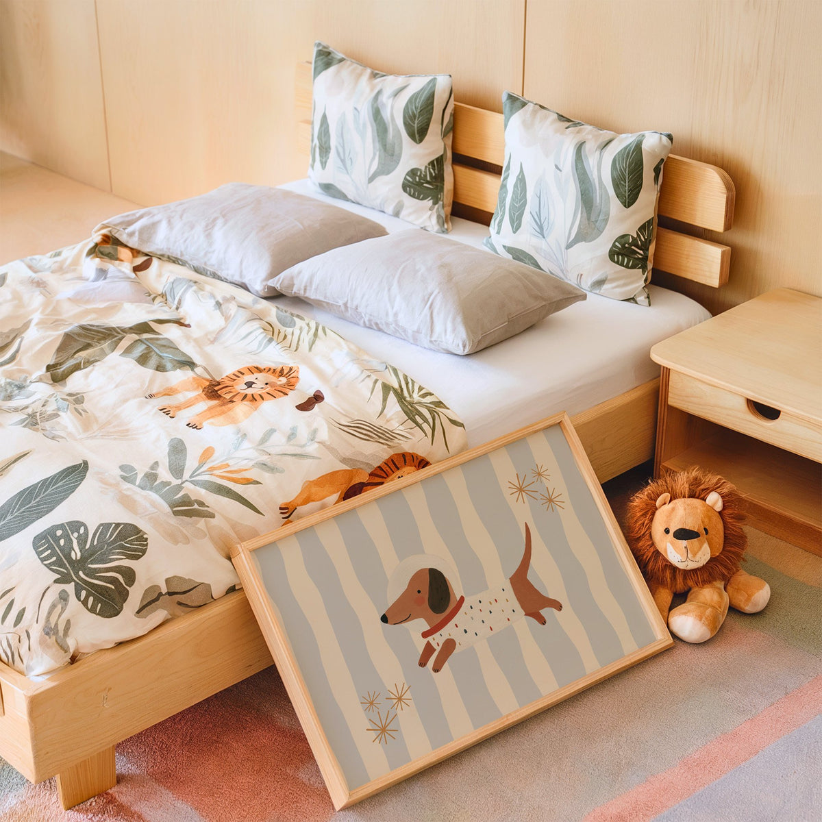 Landscape astronaut dachshund wavy stripe nursery print in an oak frame leaning on a kids bed by a lion plush