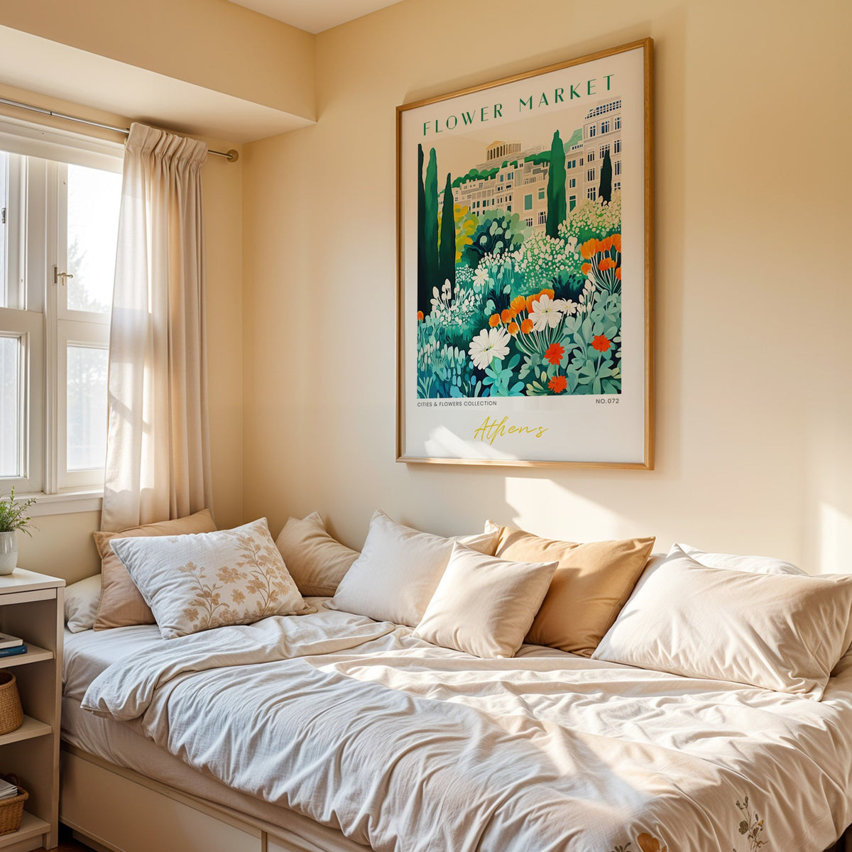 Athens flower market print in an oak frame above a cream daybed in a sunny bedroom