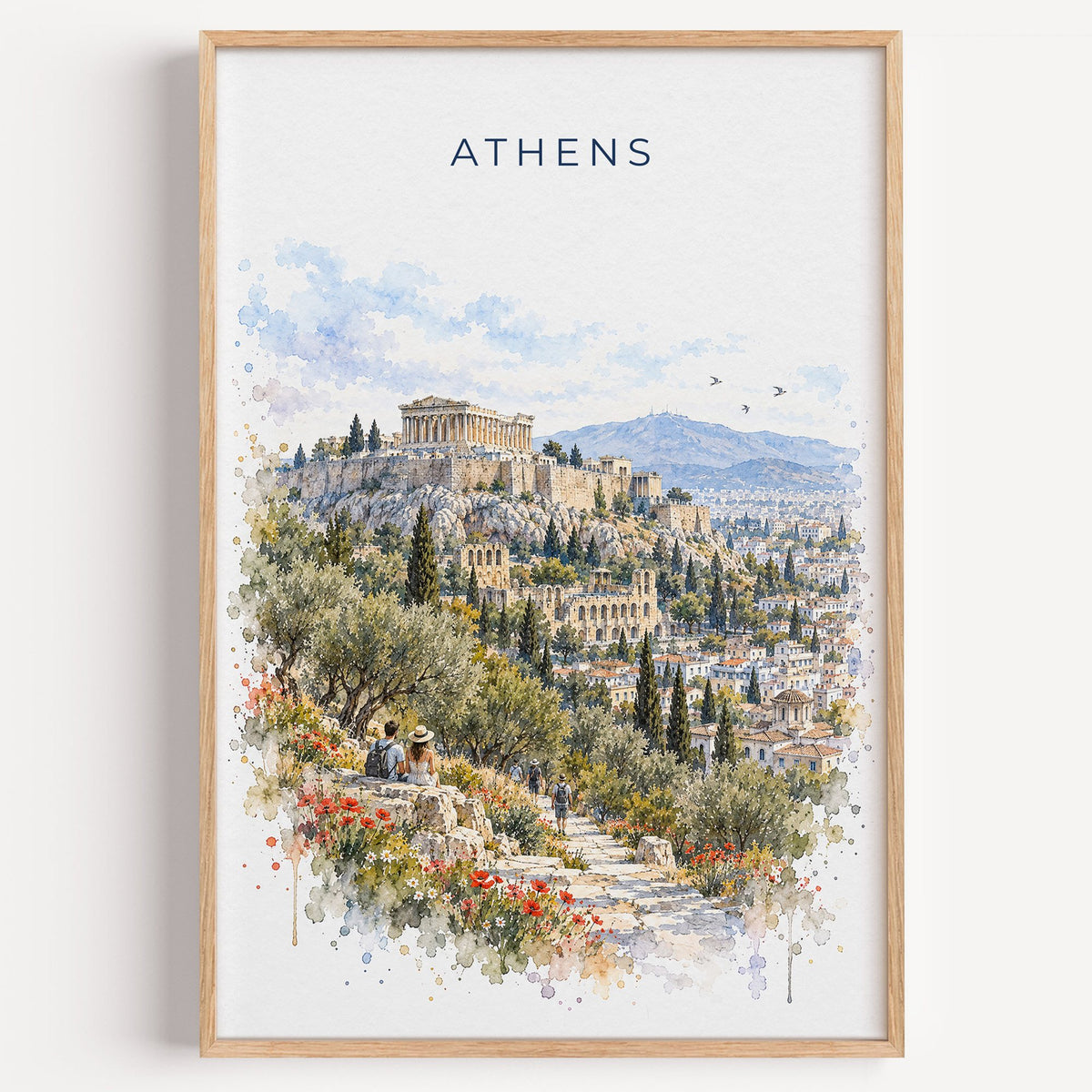 Athens, Greece watercolor print in a light oak frame on a plain white wall
