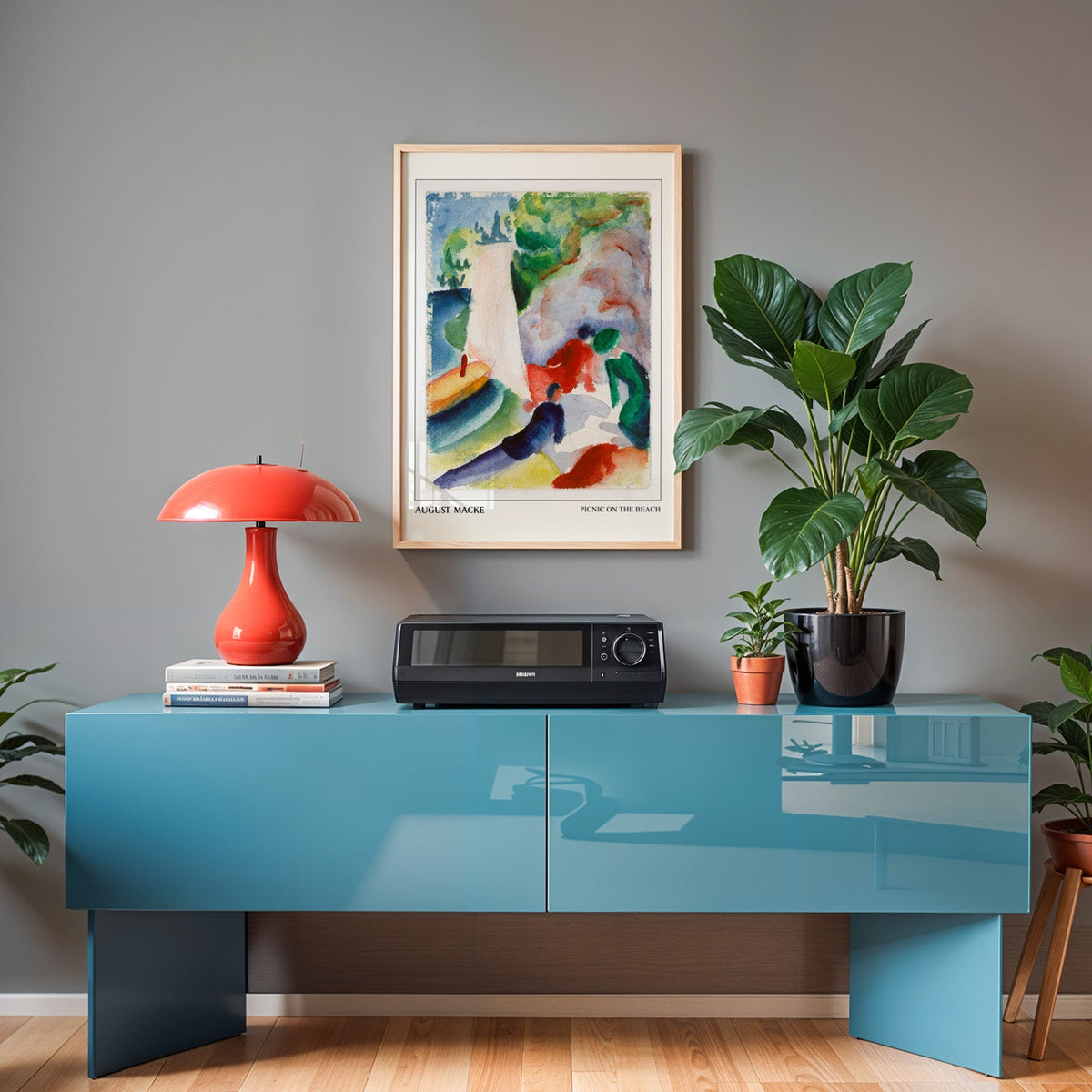 Colourful beach watercolour in an oak frame above a teal sideboard