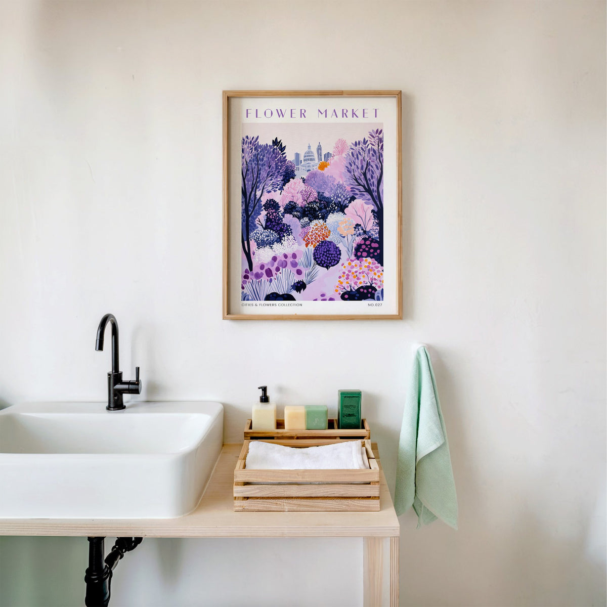 Austin flower market print in an oak frame above a white bathroom sink with folded towels