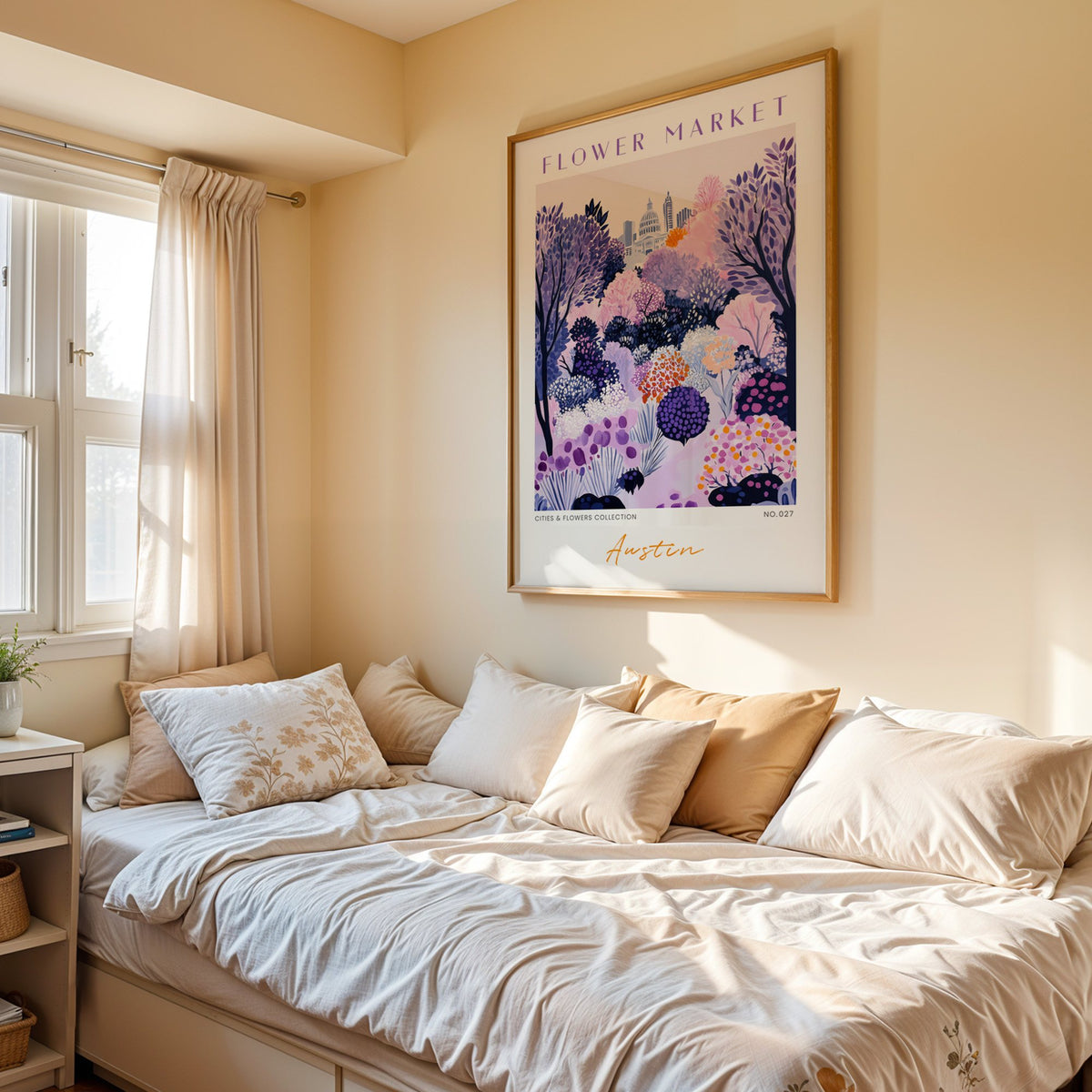 Austin flower market print in an oak frame above a cream daybed in a sunny bedroom