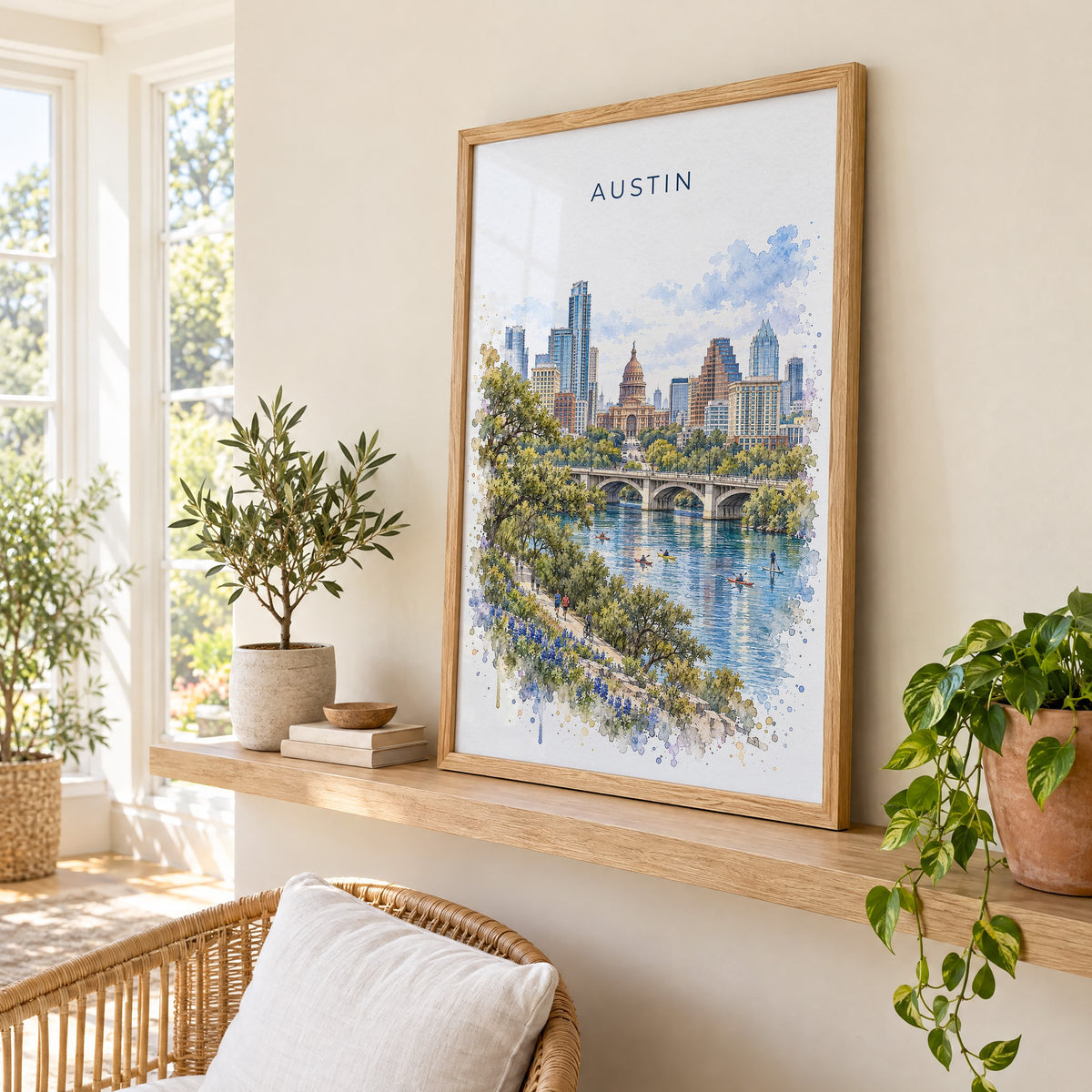 Austin watercolor print in an oak frame on a picture ledge in a sunlit sunroom