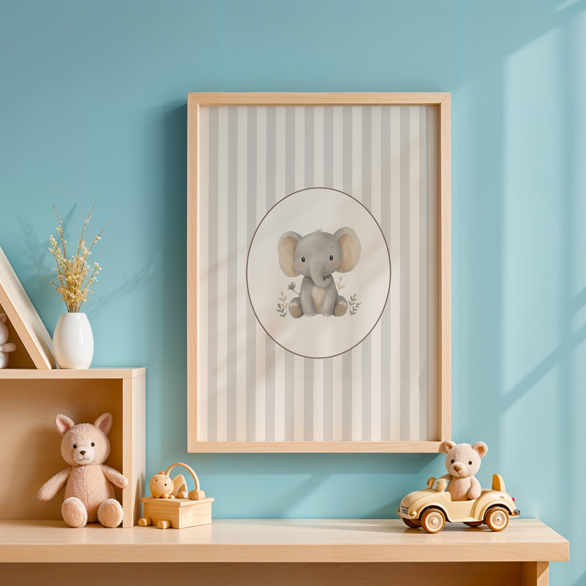 Baby elephant in a cream oval on grey stripes nursery print in an oak frame on a blue wall above a shelf of wooden toys