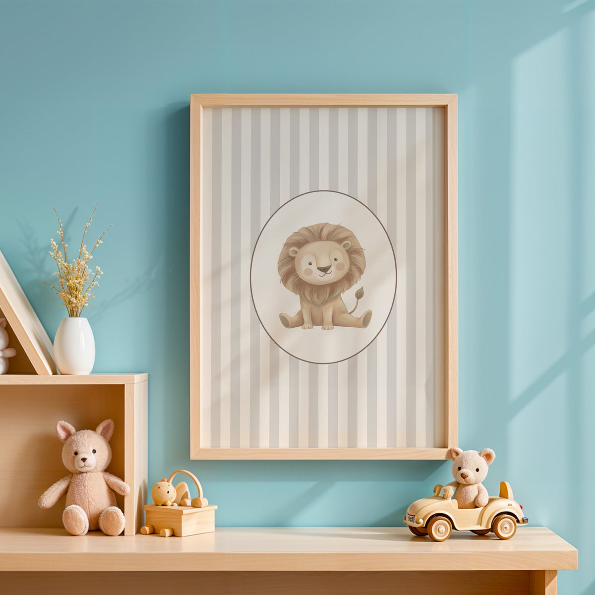 Baby lion in oval on grey stripes nursery print in an oak frame on a blue wall above a shelf of wooden toys