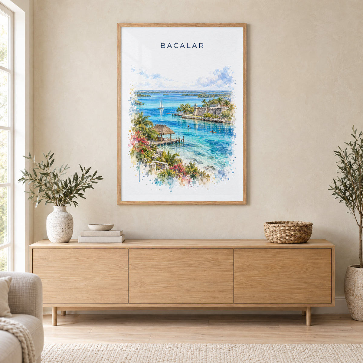 Bacalar watercolor print in an oak frame above a light wood sideboard in a Scandinavian living room