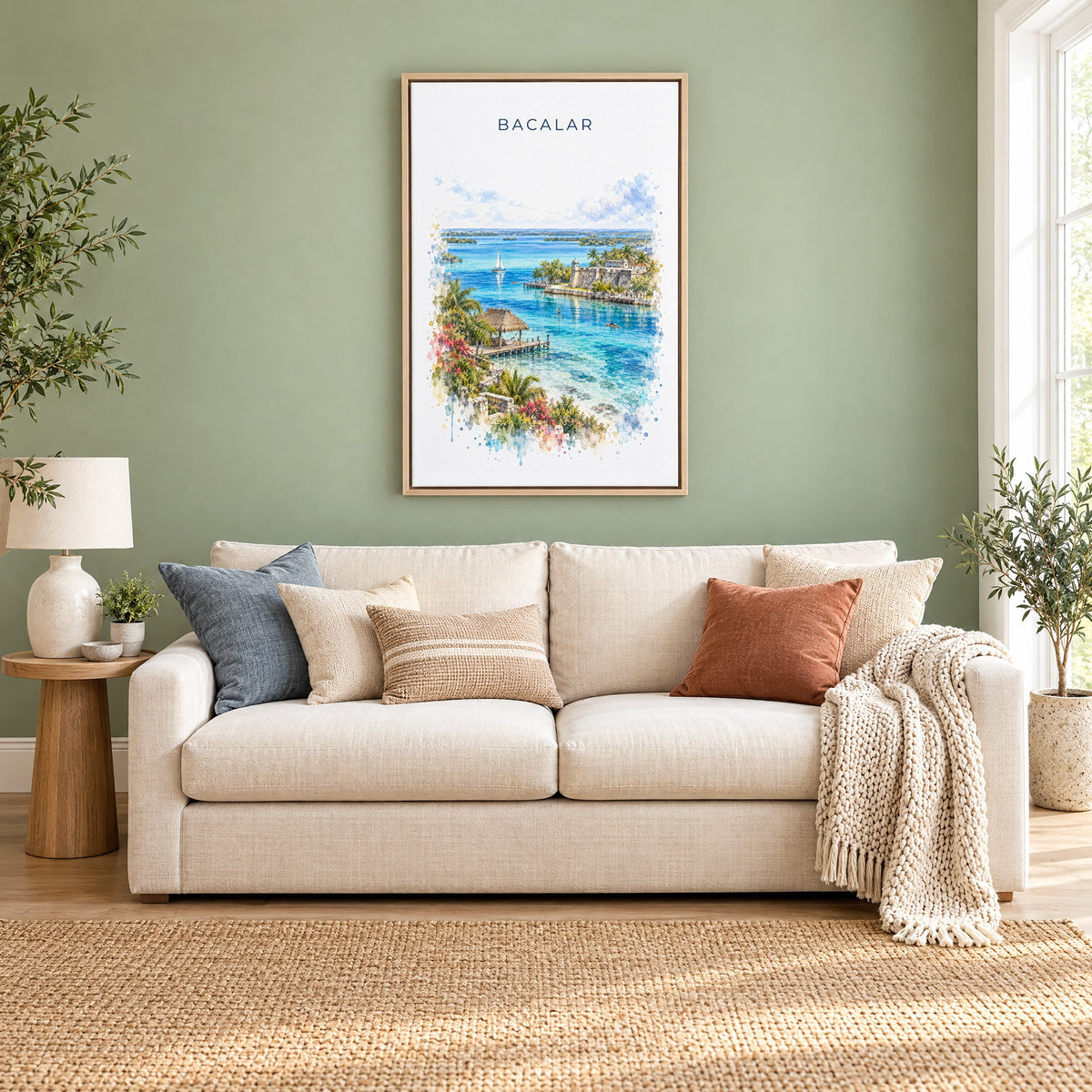 Bacalar watercolor print as a natural floater canvas above a cream linen sofa on a sage green wall