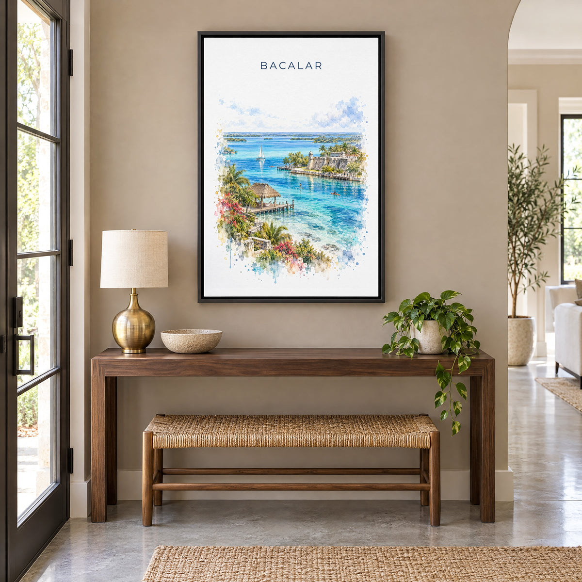 Bacalar watercolor print as a black floater canvas above a walnut console and woven bench in an entryway
