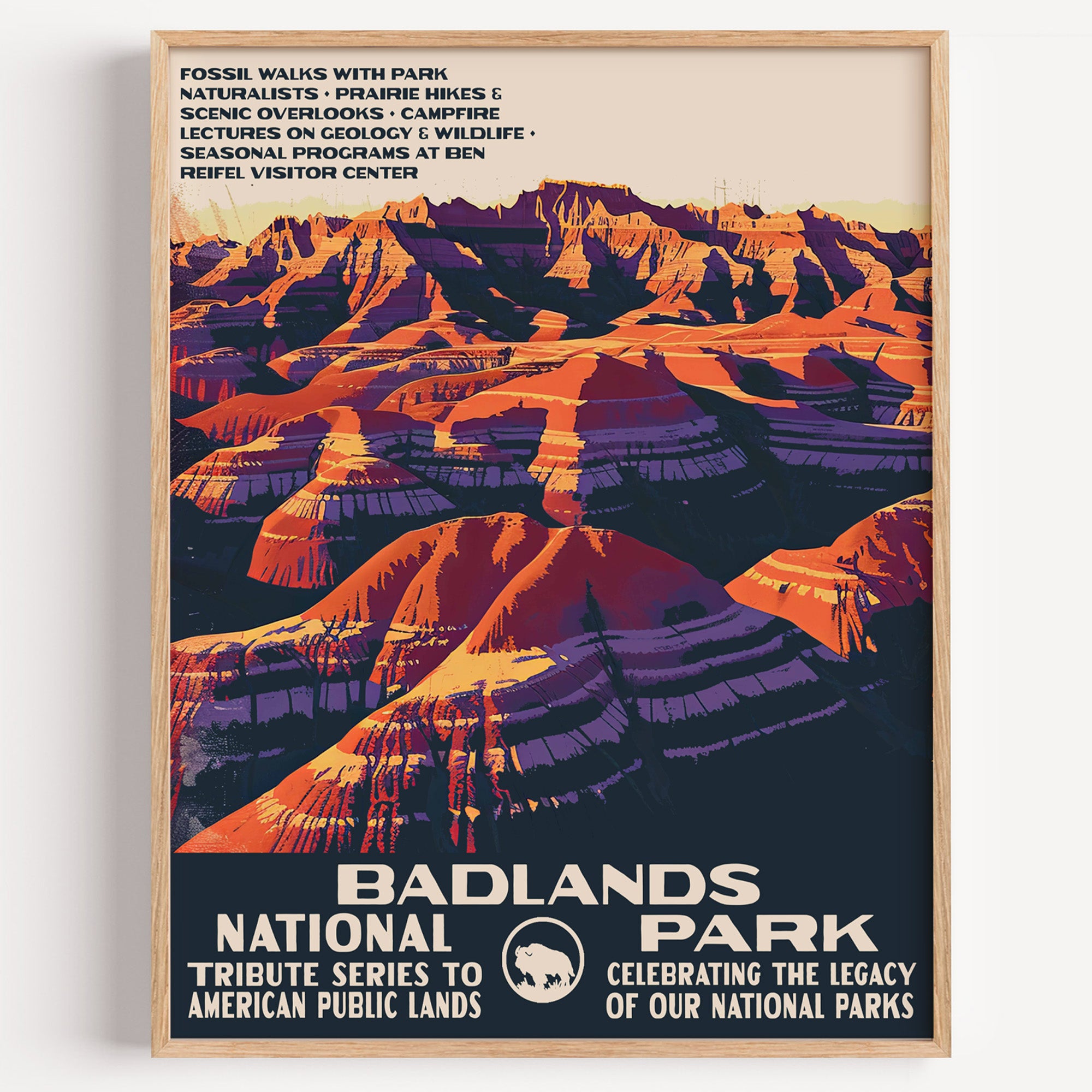 Badlands National Park wall art print in a thin wood frame, layered pink, orange and violet badland ridges