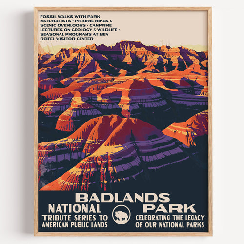 Badlands National Park wall art print in a thin wood frame, layered pink, orange and violet badland ridges