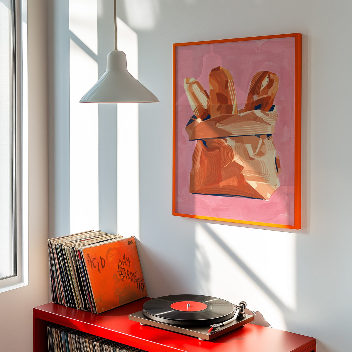 Pink baguette kitchen print shown in an orange frame above a red record cabinet and turntable