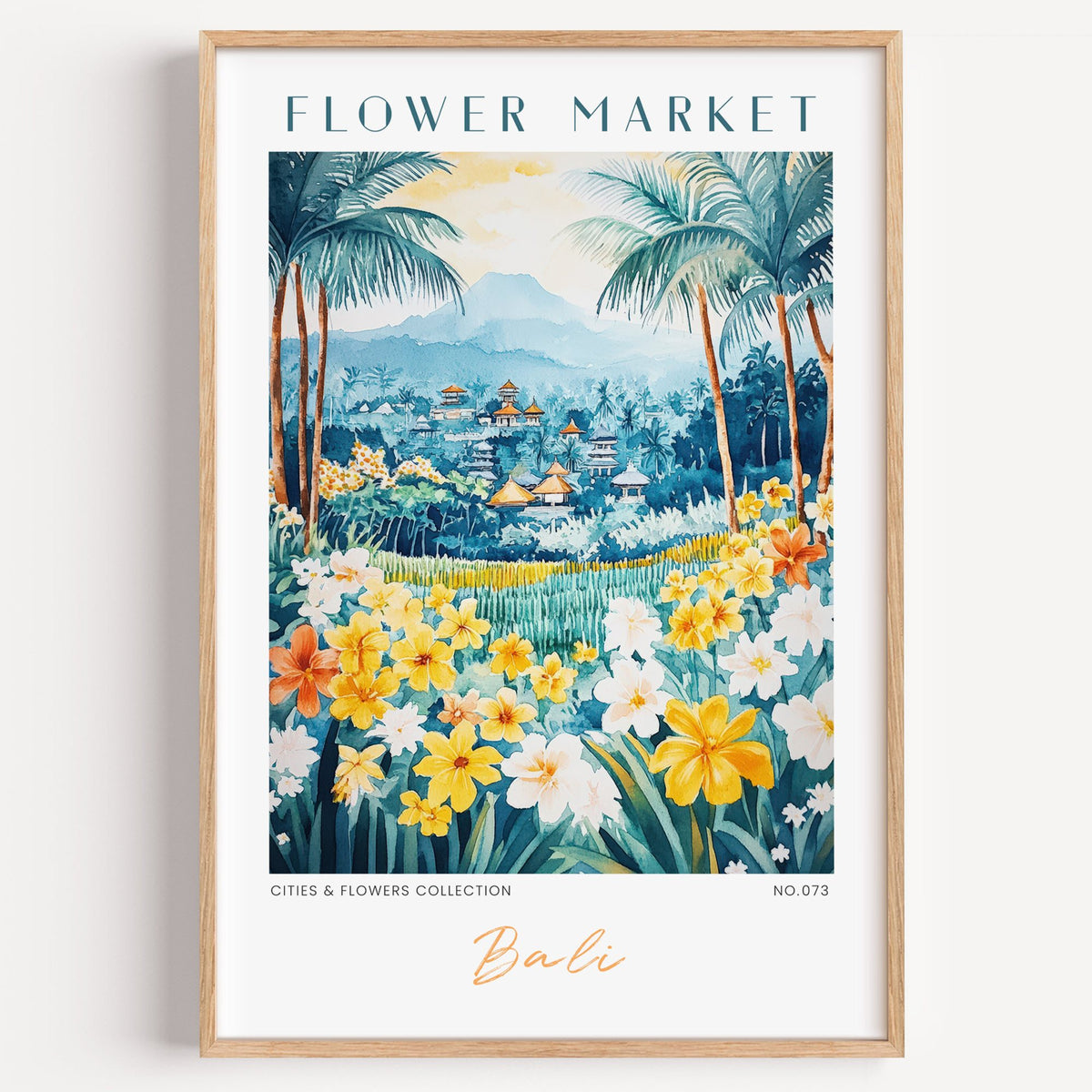 Bali flower market print in a light oak frame on a plain white wall