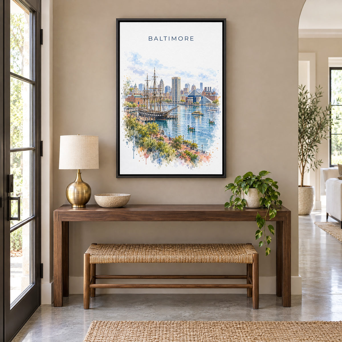 Baltimore watercolor print as a black floater canvas above a walnut console and woven bench in an entryway