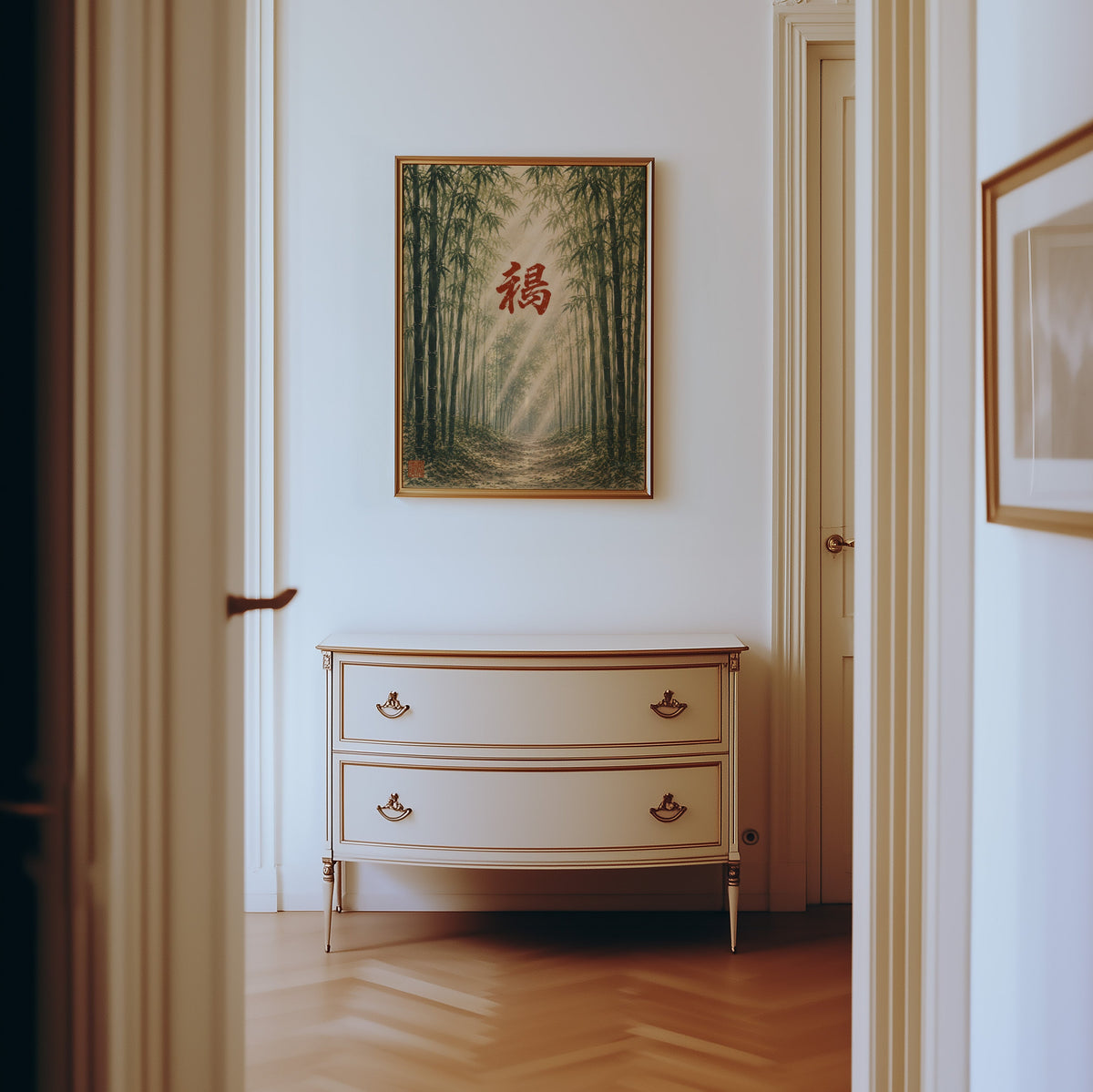 Bamboo forest red kanji poster shown in a gold frame in a hallway above a cream dresser