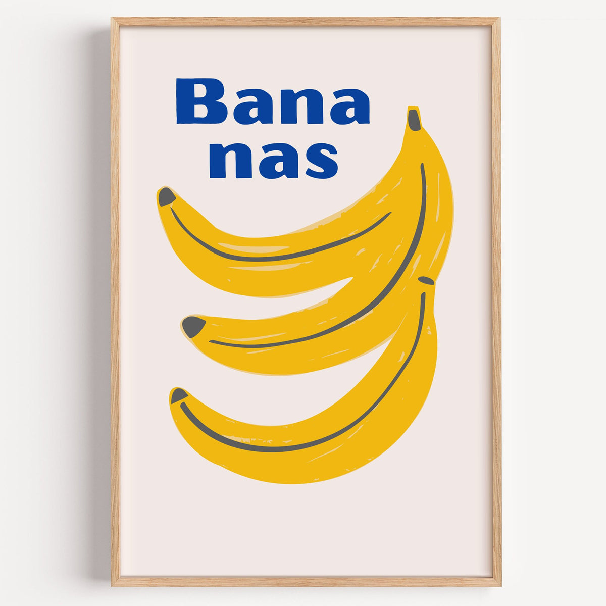 Bana nas blue type banana bunch print in a light oak frame on a plain white wall