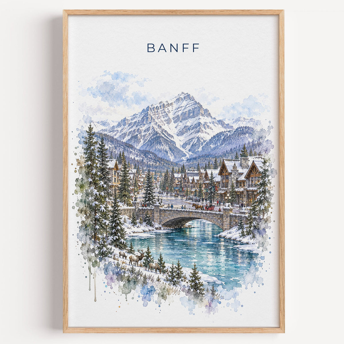 Banff watercolor print in a light oak frame on a plain white wall