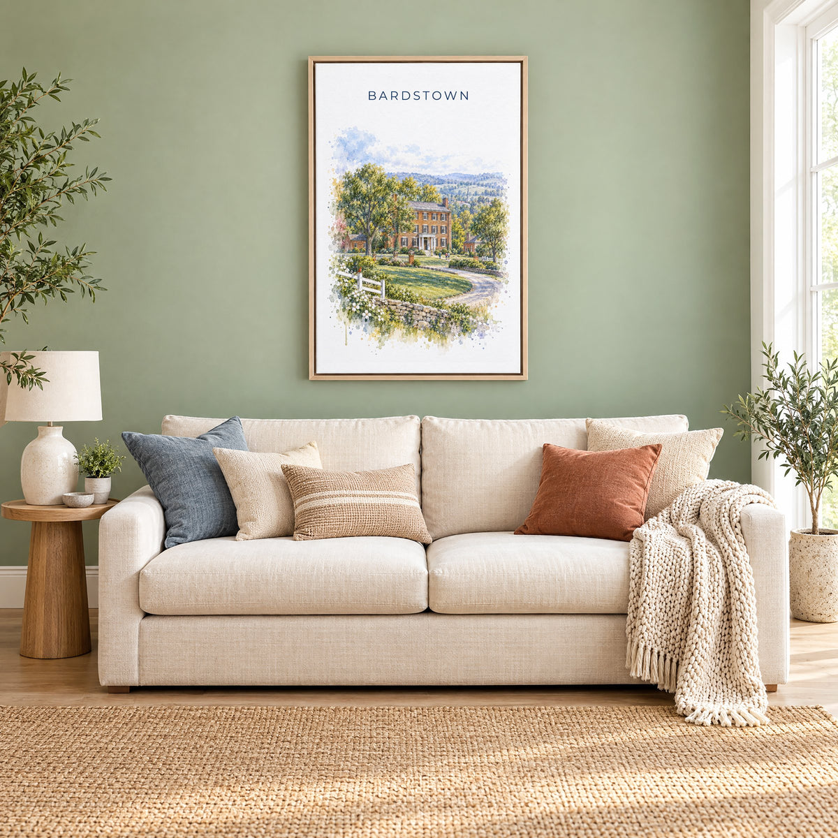 Bardstown, Kentucky watercolor print as a natural floater canvas above a cream linen sofa on a sage green wall