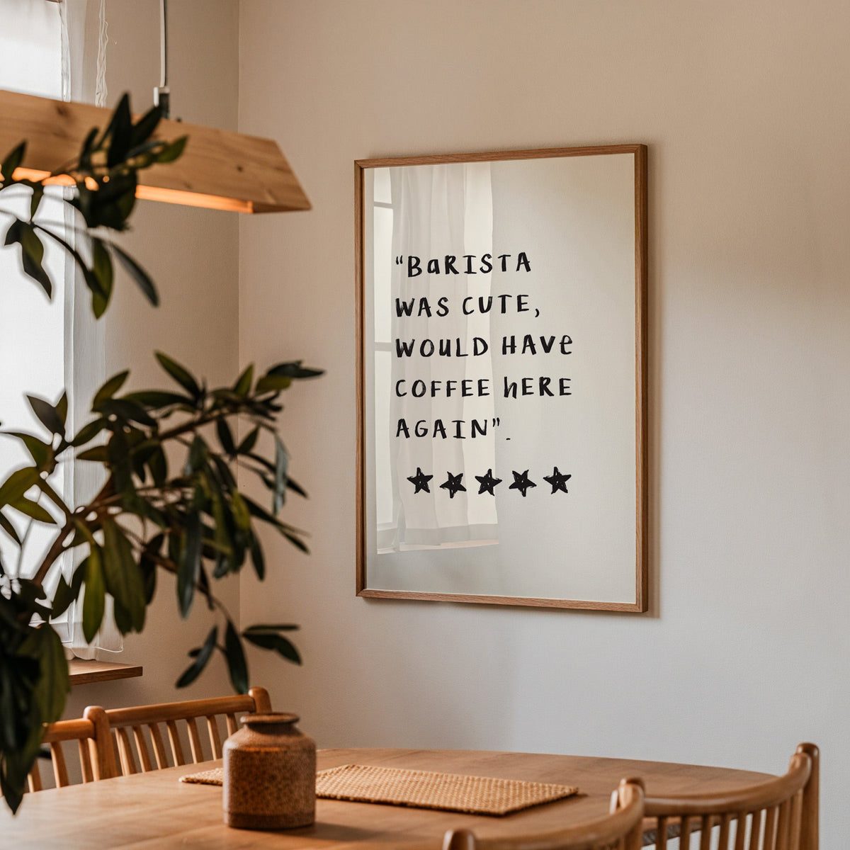 Barista was cute coffee print in a walnut frame above a dining table beside an olive tree
