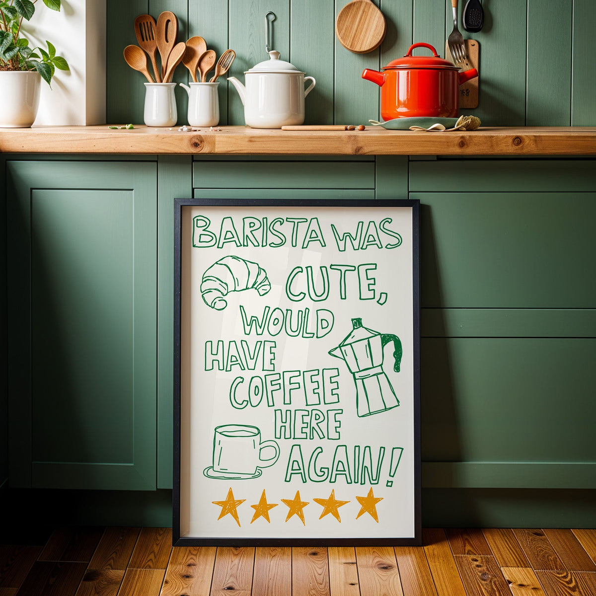 Green outline barista print in a black frame against sage green kitchen cabinets