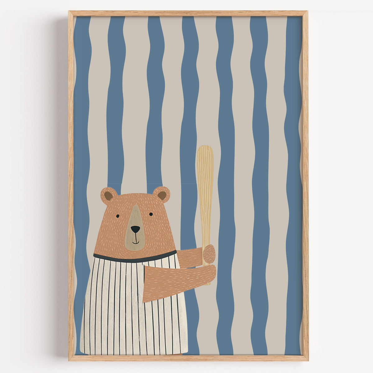 Baseball bear blue stripe nursery print in a light oak frame on a plain white wall