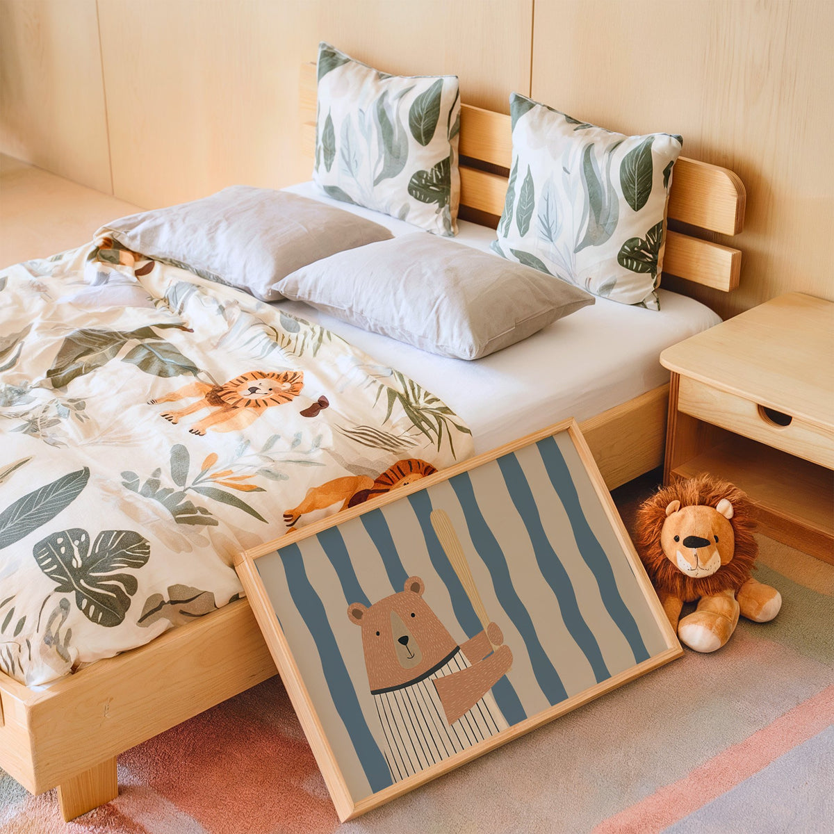 Landscape baseball bear blue stripe nursery print in an oak frame leaning on a kids bed by a lion plush