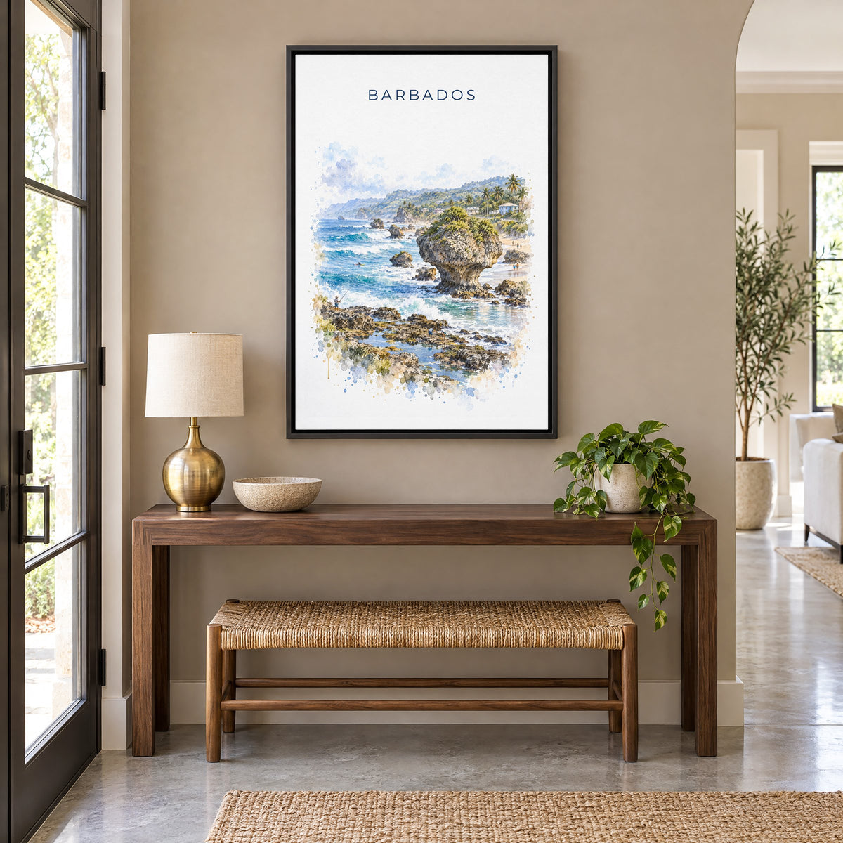 Barbados watercolor print as a black floater canvas above a walnut console and woven bench in an entryway