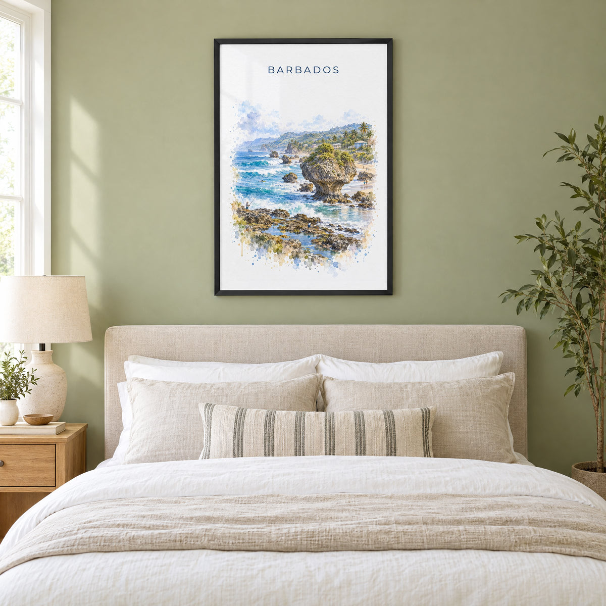 Barbados watercolor print in a black frame above an upholstered headboard in a sage green bedroom