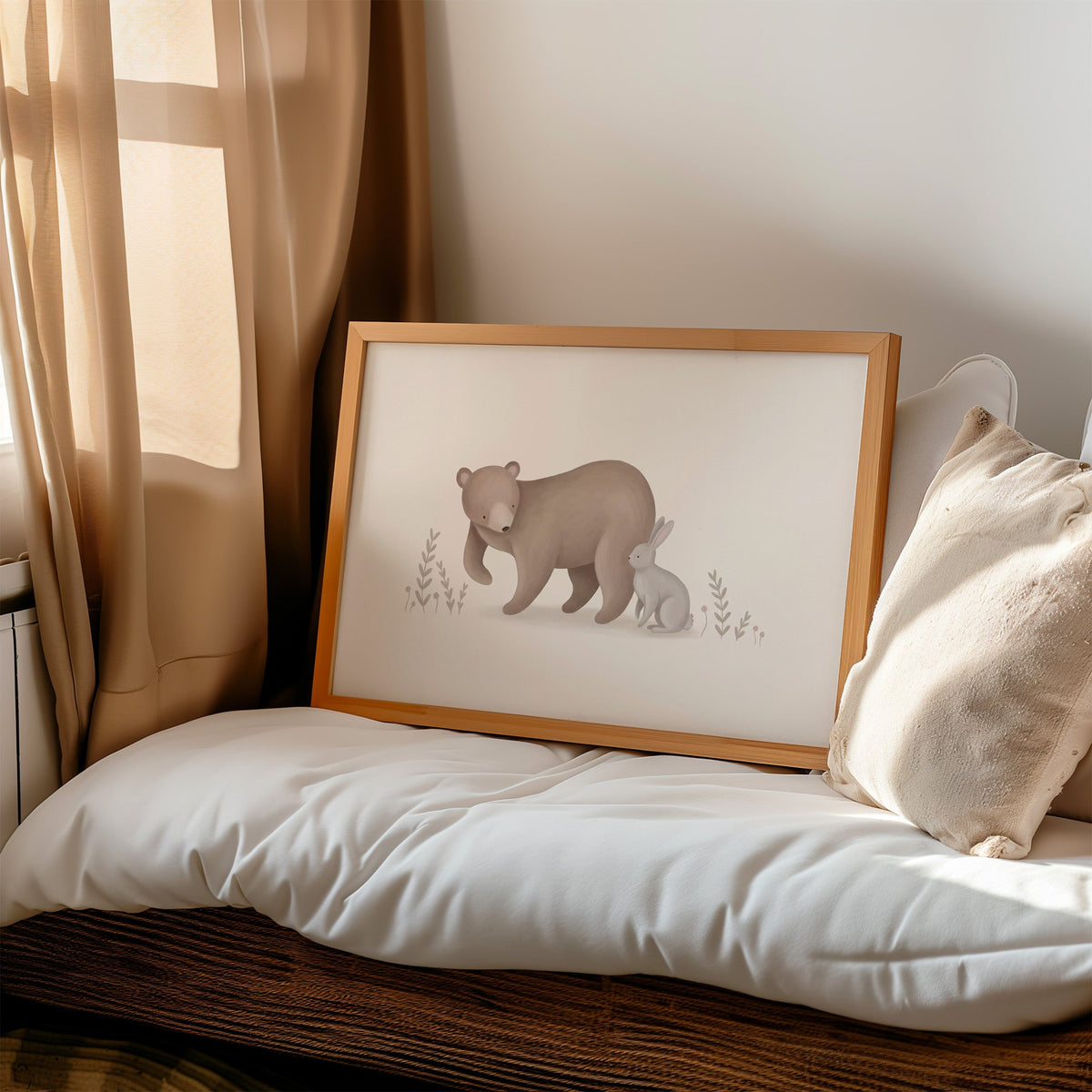 Brown bear and grey bunny in a meadow nursery print in a honey wood frame on a cushioned window seat by sheer curtains