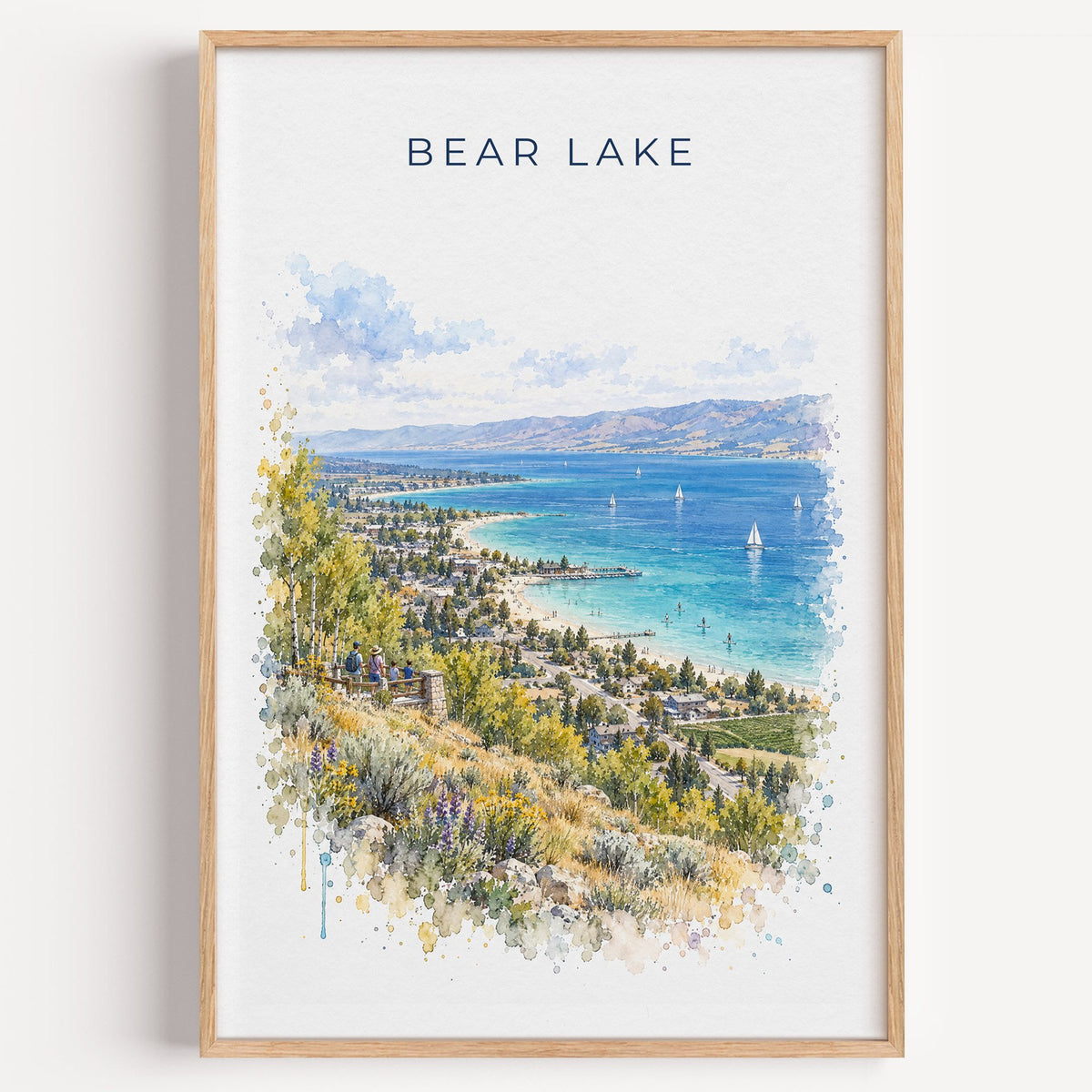 Bear Lake watercolor print in a light oak frame on a plain white wall