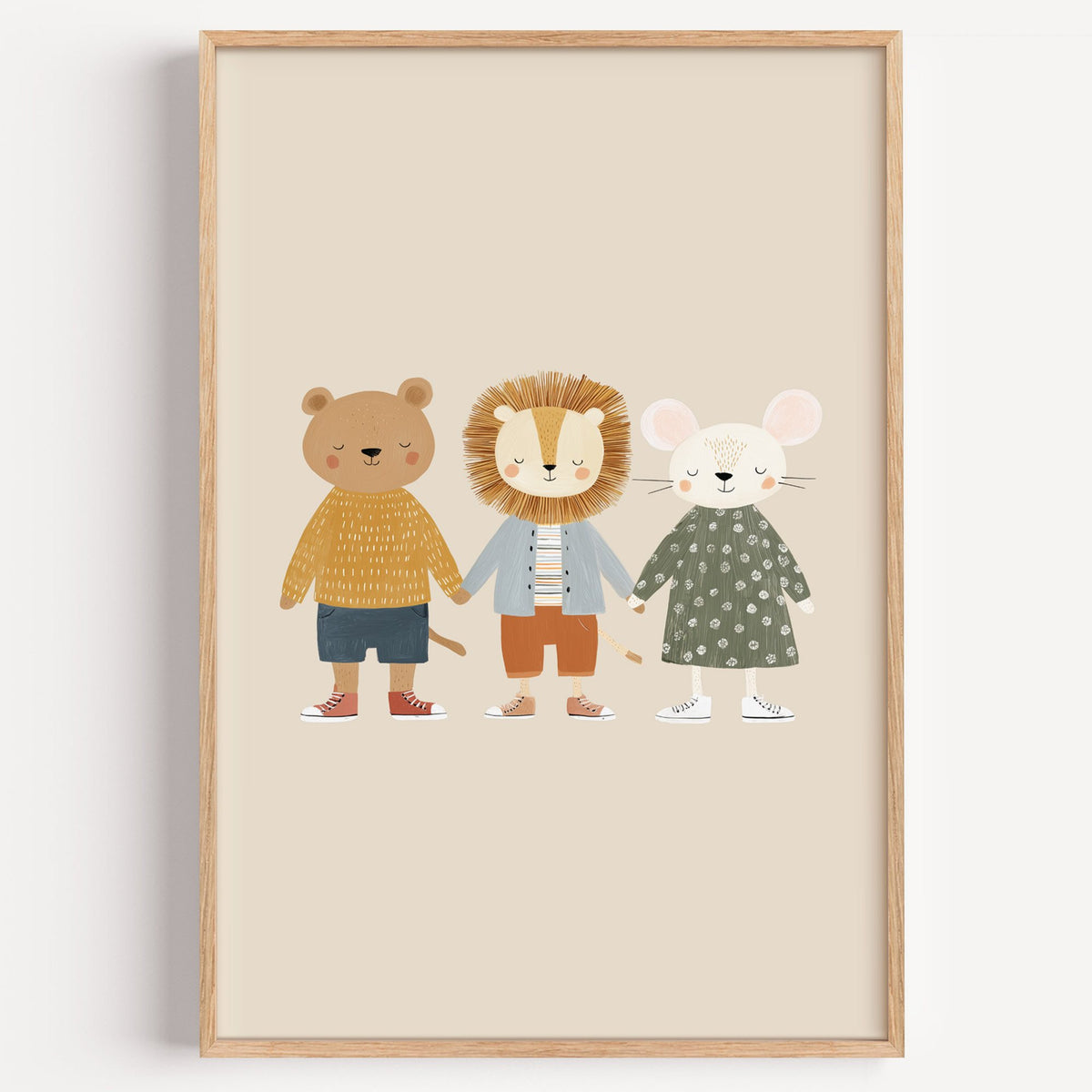 Three friends holding hands nursery print in a light oak frame on a plain white wall