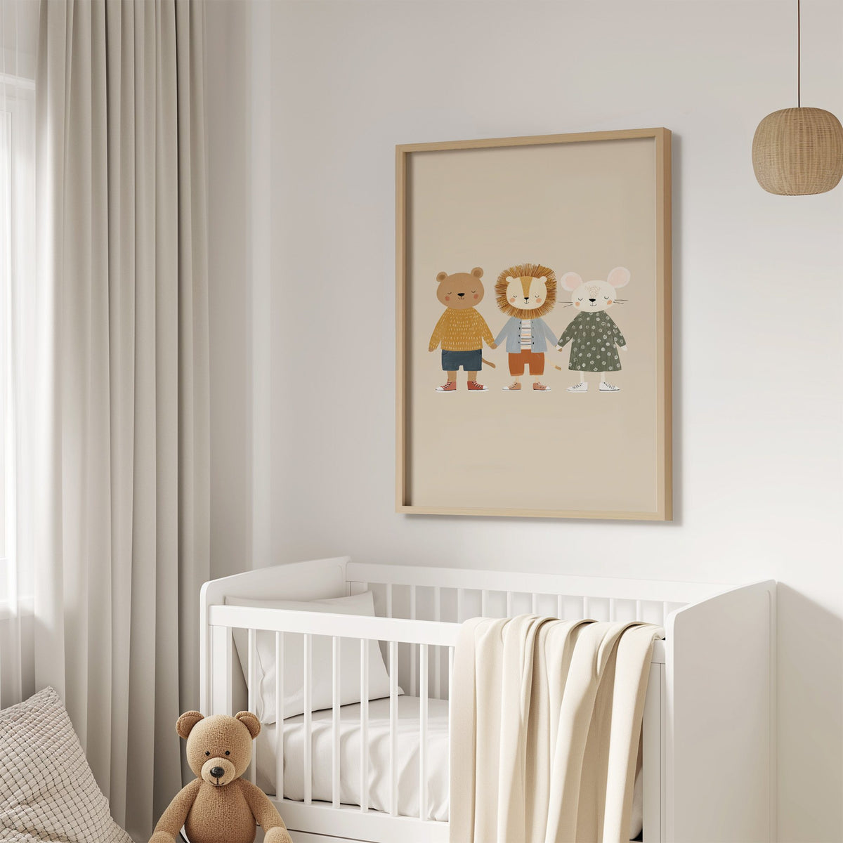 Three friends holding hands nursery print in an oak frame above a white crib with a teddy bear