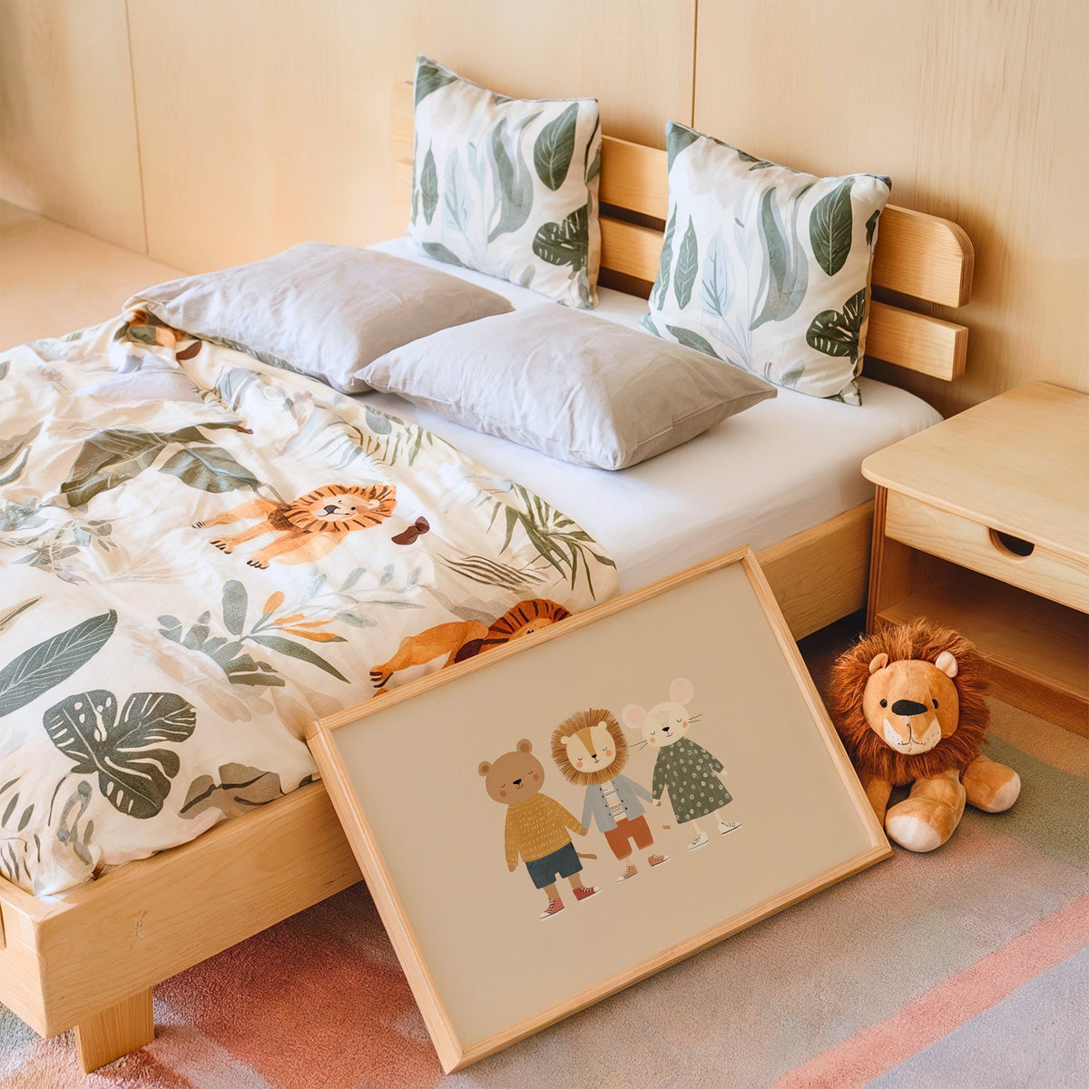 Landscape three friends holding hands nursery print in an oak frame leaning on a kids bed by a lion plush