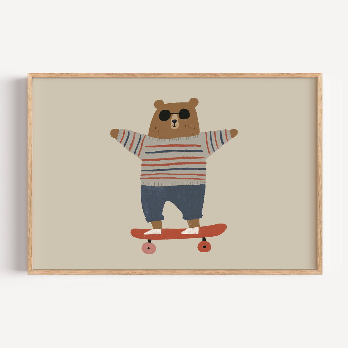 Landscape skateboard bear striped sweater nursery print in a light oak frame on a plain white wall