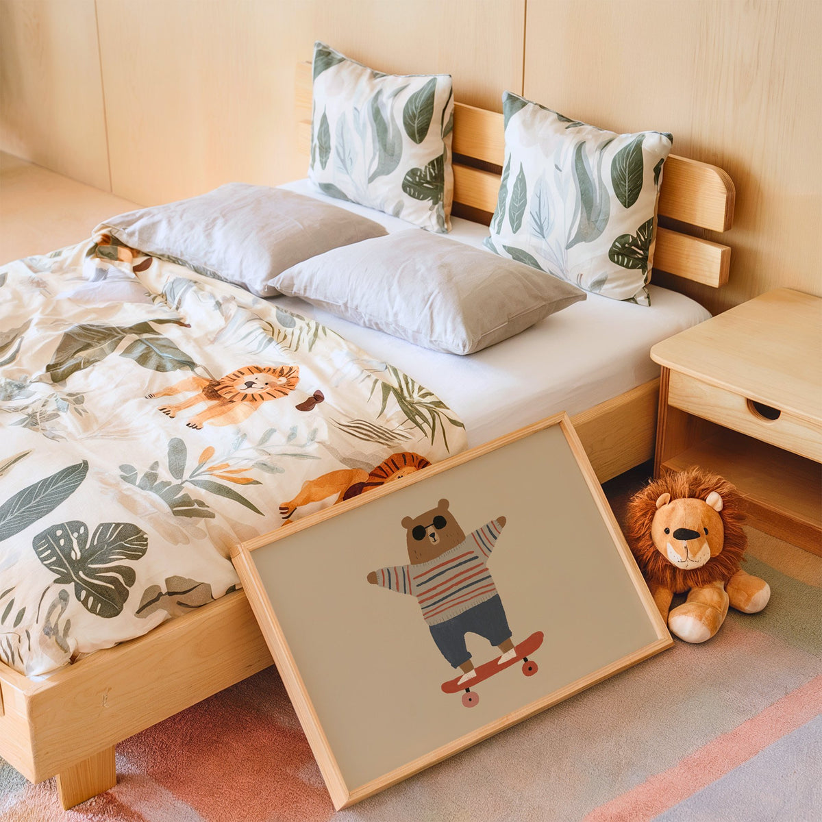 Landscape skateboard bear striped sweater nursery print in an oak frame leaning on a kids bed by a lion plush